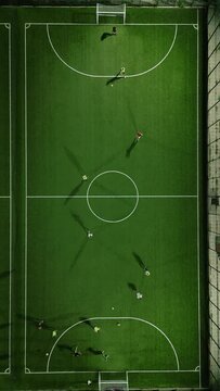 Aerial view of a mini football match, soccer. MiniFootball field and Footballers from drone