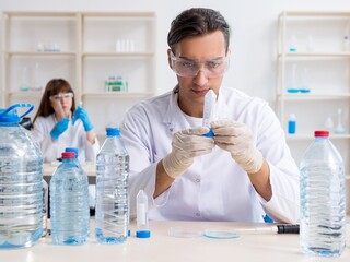 Fototapeta premium Two chemists working in the lab