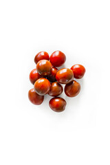 Closeup of fresh juicy organic red cherry tomatoes from the garden on isolated white background from above