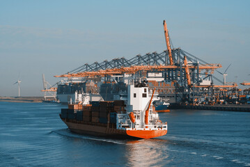 Rotterdam, the Netherlands - 06 18 2023: Several container vessels alongside the container terminal...