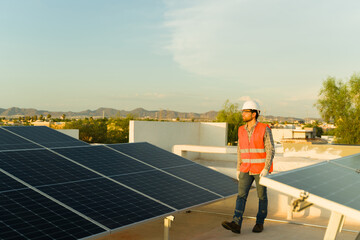Full length of an engineer installing solar panels