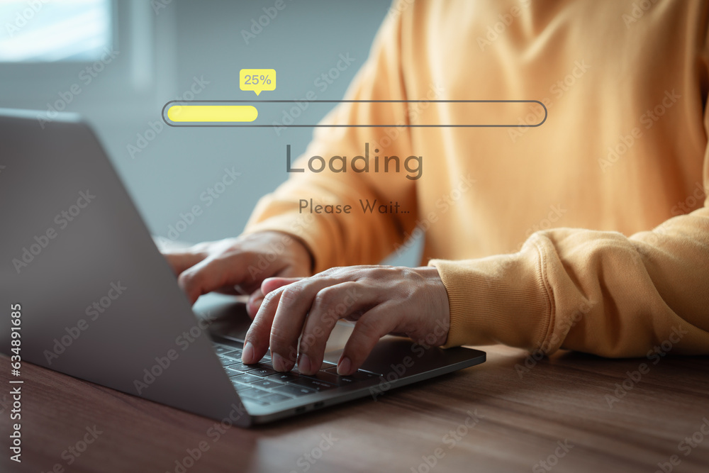 Fototapete Adult man using a laptop computer for download and update software and waiting to loading digital file data form website, very slow internet form wifi. Concept of waiting for load of loading symbol.