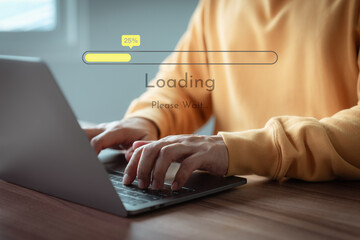 Adult man using a laptop computer for download and update software and waiting to loading digital file data form website, very slow internet form wifi. Concept of waiting for load of loading symbol.