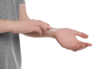 Man applying ointment onto his arm on white background, closeup