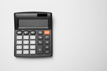 Calculator on light gray background, top view. Space for text