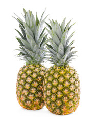 Fototapeta premium Two delicious ripe pineapples isolated on white