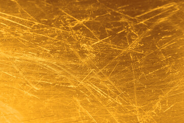 Golden textured surface as background, closeup view