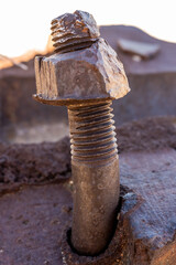 Old Rusty Nut Fused To Bent Bolt In The Ruins Of Ore Terminal