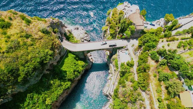 Amazing Furore Fjord aerial view: Famous and Iconic Bridge and Azure Sea in Amalfi Coast, Italy	
