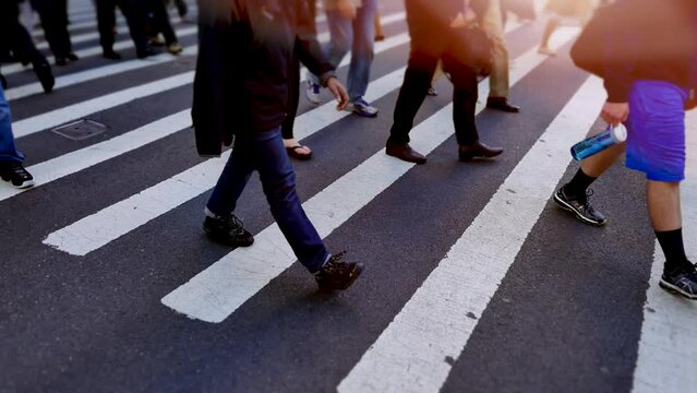 Pedestrians Commuting on Crowded Street in Rush Hour Traffic