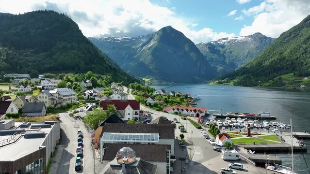 Balestrand town center in Norway with Sognefjord seafront and idyllic mountainous Esefjorden landscape in background