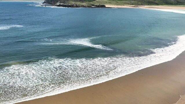 Aerial video of the Beautiful Tullagh Strands Sandy Beach on the Atlantic Ocean in County Donegal Ireland