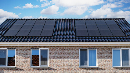 Fototapeta premium Black solar panels attached on the roof against a sunny sky Close up of new building with black solar panels. Zonnepanelen, Zonne energie, Translation: Solar panel, , Sun Energy