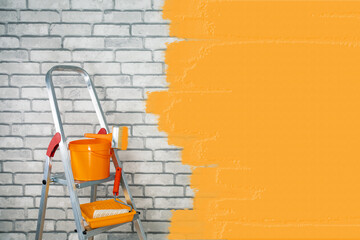  buckets with paint roller, brush and folding ladder for painting walls. renovation concept. place...