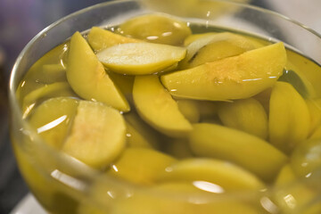 Manisan Buah Kedondong or Candied Ambarella Fruit in sweet sugar soup for dessert. Concept for Hotel Restaurant Wedding Buffet.