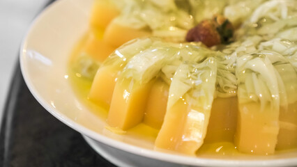 Fruit pudding with various toppings such as mint leaves, strawberries, raisins, sliced ​​almonds and chia seeds. Concept for healthy eating, fat loss, organic food, vegan diet.