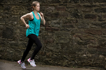Sporty woman during fitness training outdoors.
