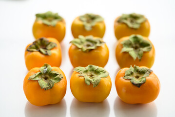 Fresh persimmon fruit in autumn season