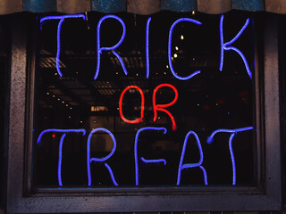 Neon sign with text Trick or treat, Halloween concept