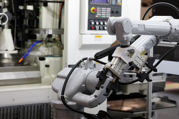 industrial robotic arm with CNC machining center
