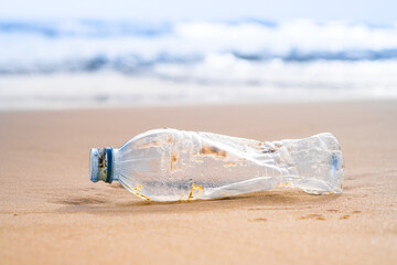 throwing bottled water on the beach marine waste problems and affects the ecosystem on the environment