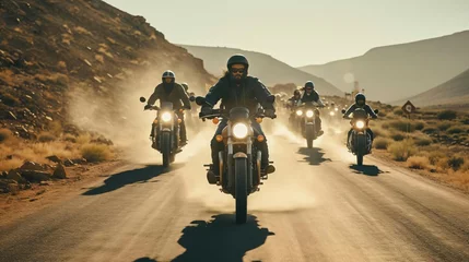 Foto op Canvas a group of people riding motorcycles on a dirt road © KWY