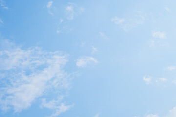 beautiful blue sky and white fluffy cloud with sunrise in the morning, natural background
