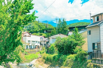 Fototapeta na wymiar Rural Scenery of Japan: Buildings and Railway in Summer