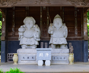 Japanese guardian statues at the traditional street in Tokyo