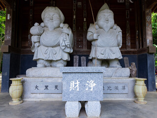 Japanese guardian statues at the traditional street in Tokyo