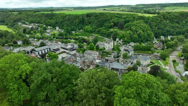 Durbuy City Aerial Reveal From Behind Green Forested Hill Top