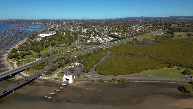 Left to right aerial view over the Houghton Highway Bridge and Brighton, Brisbane Australia.
