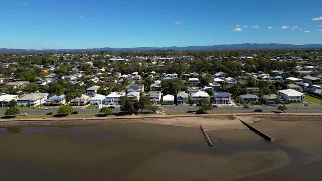 Aerial view, left to right, of Sandgate and Brighton waterfront on a sunny day, Brisbane, Queensland, Australia
