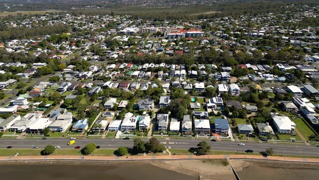 Aerial view moving left to right of Sandgate and Brighton waterfront on a sunny day, Brisbane, Queensland, Australia