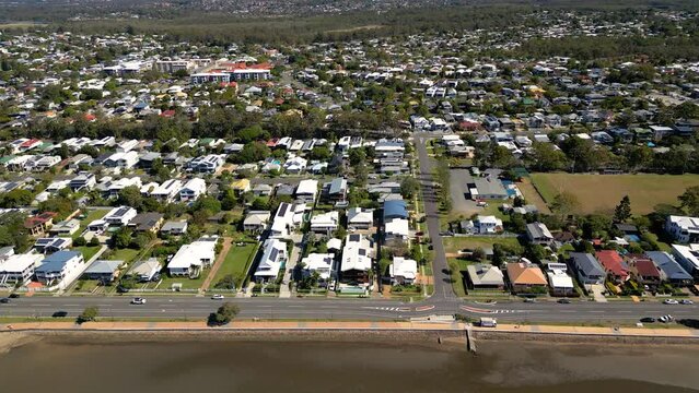 Aerial view moving left to right of Sandgate and Brighton waterfront on a sunny day, Brisbane, Queensland, Australia