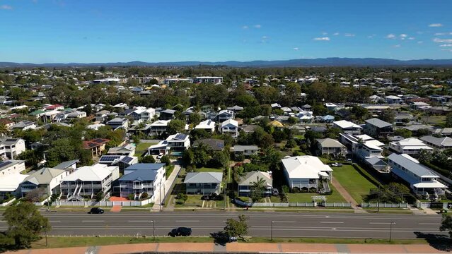 Aerial view of housing on the Sandgate and Brighton waterfront on a sunny day, Brisbane, Queensland, Australia