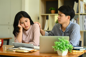 Caring male student consoling his female friend. Friendship, support and youth lifestyle concept