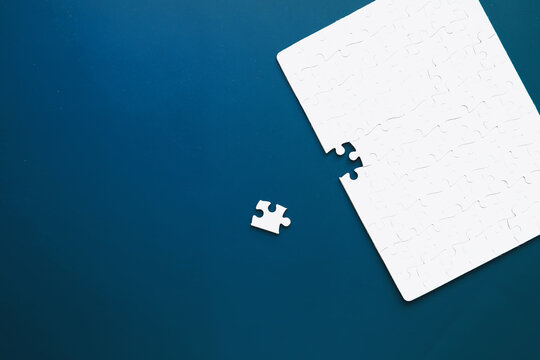 IQ development. Intellectual puzzles. The puzzle is empty. Brain training hand puts puzzle pieces together.