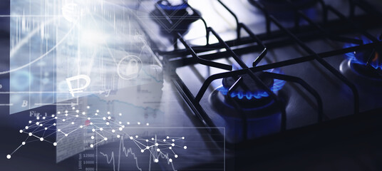  Flames of natural gas stove boiling water in a blue kettle at home. Built-in gas panel. The kettle is on the stove.Gas crisis