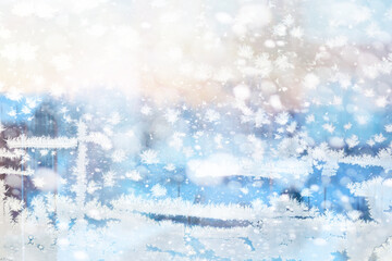 Winter landscape through a frozen window. Blurred snow background. Trees and plants covered with snow.