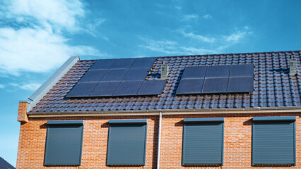 Fototapeta premium Newly build houses with solar panels attached on the roof , Solar panel on a roof
