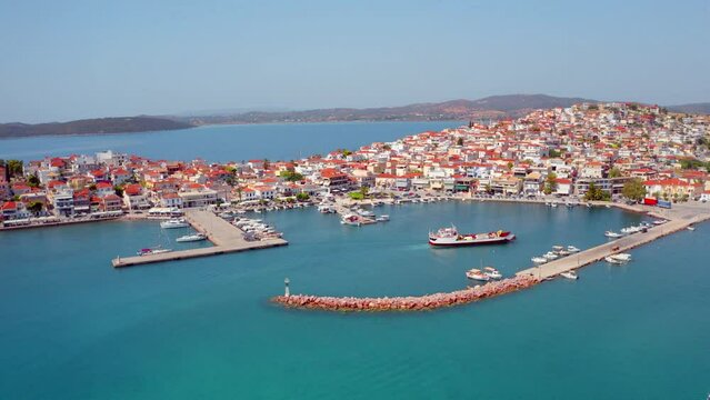 4k drone flight moving to the side footage (Ultra High Definition) of Ermioni port. Sunny morning seascape of Ionian sea. Amazing outdoor scene of Peloponnese peninsula, Greece, Europe.