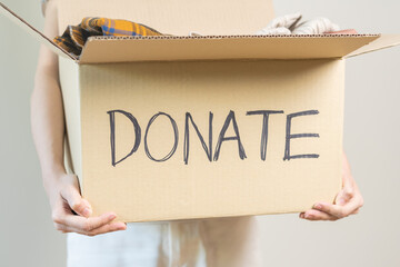 Recycling, Donation for poor, asian young woman pack, hand in holding donate box full with second...
