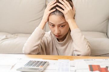 Financial owe asian young woman, girl sitting suffer, stressed and confused by calculate expense...