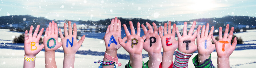 Children Hands Building Word Bon Appetit, Winter Background