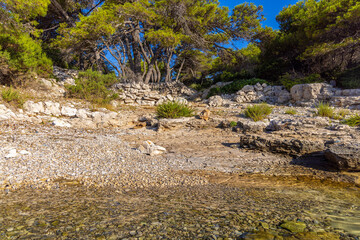The pebble beach on the Kaprije Island, the Adriatic Sea in Croatia