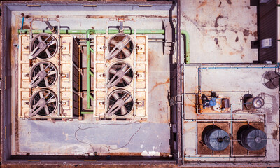 Old external air conditioning units on a roof top. Aerial view of air conditioning unit machine...