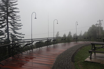 outside dining area with a misty aerial view