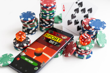 Online gambling concept. Smartphone, roulette,playing cards, chips and dice. 3D illustration.