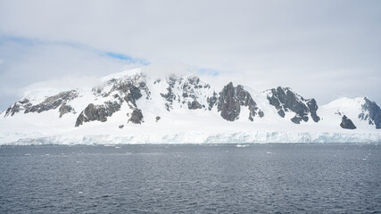 Obraz premium Antarctica mountains and sea. South Pole. On a sunny day
